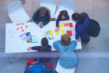 View from above to mathematical activities with children around a table