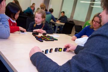 Family playing Qwirkle